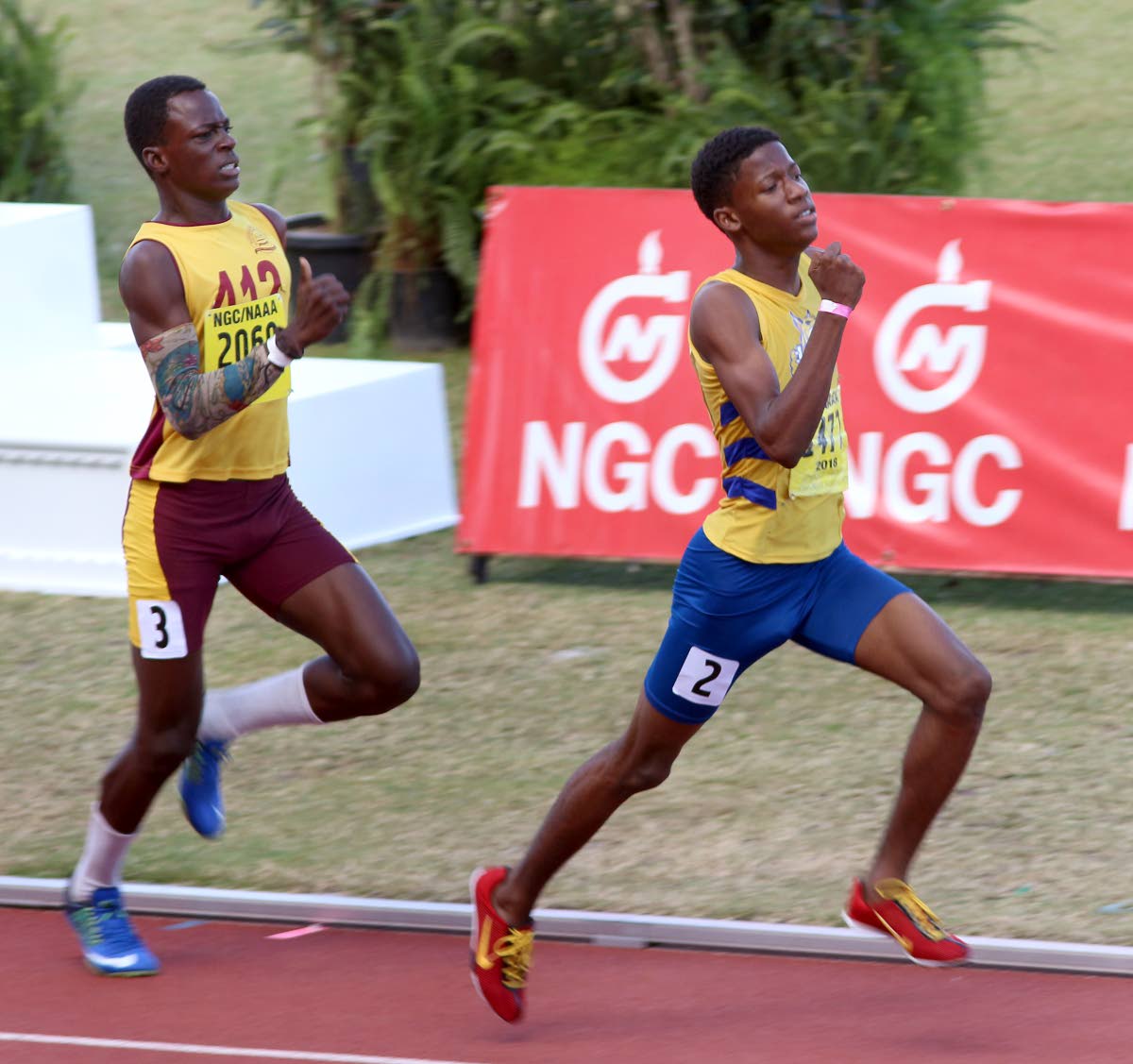 Mishak Peters, right, of Abilene Wildcats, wins the boys U17 800m final in a time of 2:03:54 secs, at the NGC/NAAA Jr Championships, Hasely Crawford Stadium, Port of Spain, yesterday.
