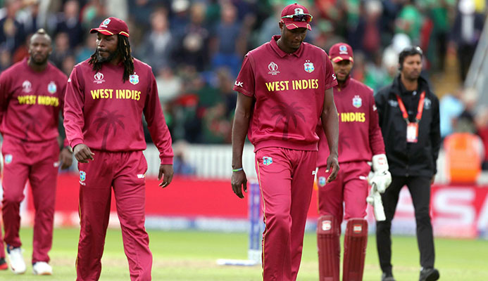 DEJECTED! West Indies captain Jason Holder, centre, lead his players walk off dejected after losing the Cricket World Cup match between West Indies and Bangladesh at The Taunton County Ground, Taunton, south west England, yesterday. (AP)