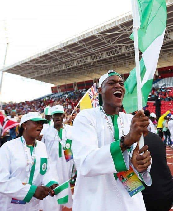 Samuel Ogazi with the Nigerian contingent at the opening ceremony for the Commonwealth Youth Games. - (Image obtained at newsday.co.tt)