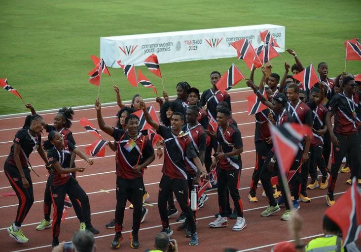 UNITED FRONT: T&T athletes at the opening ceremony of the Commonwealth Youth Games at the Hasley Crawford Stadium, Mucurapo, earlier this month. —Photo: DEXTER PHILIP (Image obtained at trinidadexpress.com)