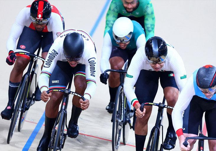 CAUGHT WIDE: TTO’s ace sprint cyclist Nicholas Paul, left, is forced to angle out to the four-path on the penultimate lap of the men’s keirin event at the Velódromo at the Parque de Peñalolén last evening. Paul followed home Colombian Kevin Quintero, second from left, to take silver in this discipline at the Pan American Games in Santiago, Chile. --Photo: Photosport/Panam Sports (Image obtained at trinidadexpress.com)