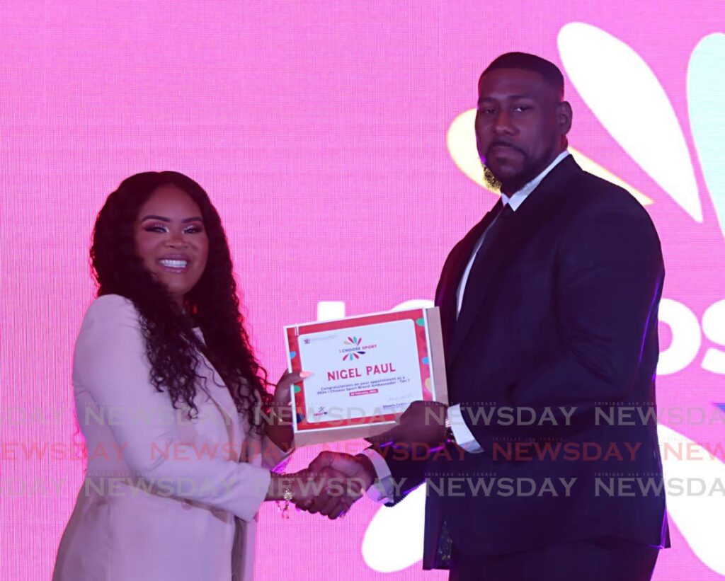 National boxer Nigel Paul, receives his 2024 I Choose Sport Brand Ambassador appointment, from Minister of Sport and Community Development Shamfa Cudjoe-Lewis, at Hyatt Hotel, Port of Spain on February 26. - Photo by Angelo Marcelle (Image obtained at newsday.co,tt)