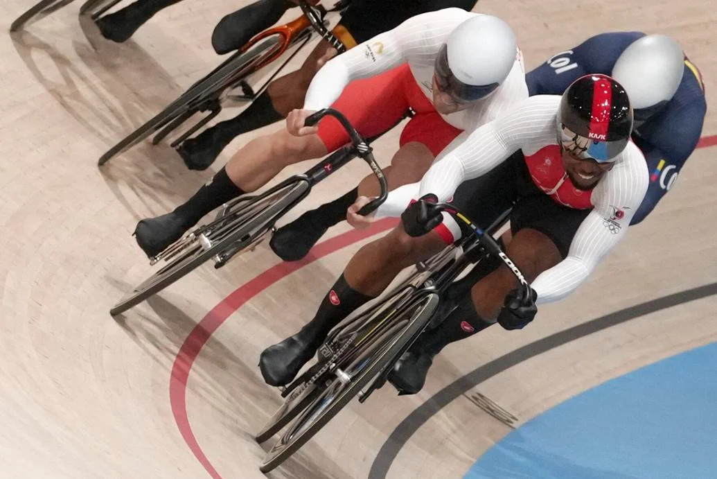 PUSHING THE PACE: Nicholas Paul of Trinidad and Tobago, foreground, leads Mateusz Rudyk of Poland and Cristian David Ortega Fontalvo of Colombia, right, during a men’s keirin first-round heat at the Summer Olympics, yesterday, in Paris, France. —Photo: AP  Thibault Camus (Image obtained at trinidadexpress.com)