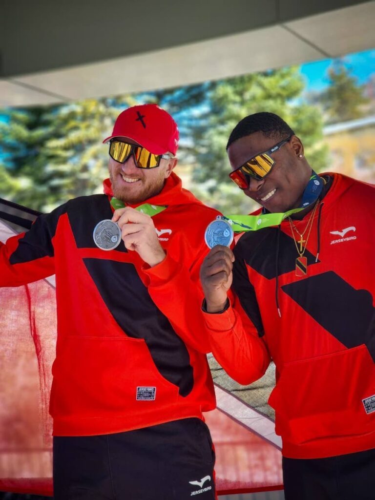 Trinidad and Tobago's two-man bobsleigh team of Axel Brown, left, and Du Aundre John celebrate their silver medal placing at the Park City leg of the North American Cup in Utah on December 1. - Photo courtesy Axel Brown (Image obtained at newsday.co.tt)