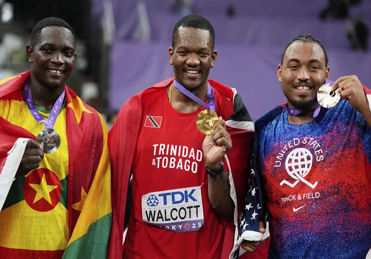CHAMPS: Trinidad and Tobago’s gold medallist Keshorn Walcott, centre, stands with Grenada’s silver medallist Anderson Peters, left, and United States’ bronze medallist Curtis Thompson following the men’s javelin throw final at the World Athletics Championships in Tokyo, Japan, yesterday. (Image obtained at trinidadexpress.com)